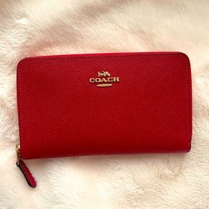Coach red leather wallet with multiple compartments